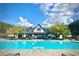A view of the sparkling pool with comfortable lounge chairs for relaxation at 78 Cuthbert Ln Ne, Acworth, GA 30101