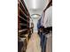 Custom walk-in closet featuring ample shelving, hanging racks, and laminate flooring at 78 Cuthbert Ln Ne, Acworth, GA 30101