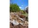 Scenic waterfall feature cascading down a stone hillside with lush landscaping at 78 Cuthbert Ln Ne, Acworth, GA 30101