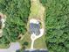 An aerial view of a beautiful property with a large pool and well-maintained landscaping at 4233 Sandstone Shores Dr, Stonecrest, GA 30038