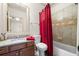 Cozy bathroom featuring a granite countertop, shower-tub combination, and neutral color scheme at 4233 Sandstone Shores Dr, Stonecrest, GA 30038