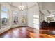 Bright dining area with hardwood floors, ample natural light, and views of the backyard at 4233 Sandstone Shores Dr, Stonecrest, GA 30038