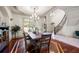 Elegant dining area featuring hardwood floors, stylish furnishings, and large windows at 4233 Sandstone Shores Dr, Stonecrest, GA 30038