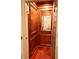 A beautiful wood-paneled elevator features an internal mirror, providing easy access to all floors at 4233 Sandstone Shores Dr, Stonecrest, GA 30038