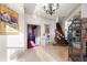 Welcoming foyer with travertine flooring, ornate staircase, and decorative lighting at 4233 Sandstone Shores Dr, Stonecrest, GA 30038