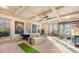Spacious game room with coffered ceiling, pool table, lounging area, and ample light at 4233 Sandstone Shores Dr, Stonecrest, GA 30038