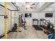 Home gym with weight machines, treadmills, and a mirrored wall for workouts at 4233 Sandstone Shores Dr, Stonecrest, GA 30038