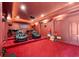 Impressive home theater featuring tiered seating, a projector, and a popcorn machine at 4233 Sandstone Shores Dr, Stonecrest, GA 30038