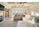 Inviting living room with a coffered ceiling, fireplace, built-in shelving, and a plush sectional sofa at 4233 Sandstone Shores Dr, Stonecrest, GA 30038