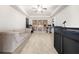 Entertainment room with sectional sofa, custom shelving, and stylish decor at 4233 Sandstone Shores Dr, Stonecrest, GA 30038