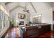 Bright living room boasting vaulted ceilings, fireplace, hardwood floors, and oversized windows at 4233 Sandstone Shores Dr, Stonecrest, GA 30038