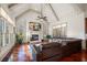 Bright living room featuring vaulted ceilings, hardwood floors, and a fireplace at 4233 Sandstone Shores Dr, Stonecrest, GA 30038