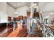 Open-concept living space with a staircase, kitchen, and a wrought iron railing at 4233 Sandstone Shores Dr, Stonecrest, GA 30038