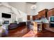 Open-concept living area with fireplace, kitchen, and vaulted ceilings at 4233 Sandstone Shores Dr, Stonecrest, GA 30038