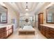 Luxurious bathroom featuring a jetted tub, dual vanities, and a separate shower, creating a spa-like experience at 4233 Sandstone Shores Dr, Stonecrest, GA 30038
