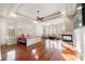 This main bedroom features hardwood floors, a fireplace, and ample seating for a luxurious retreat at 4233 Sandstone Shores Dr, Stonecrest, GA 30038