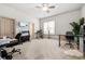 Home office with neutral carpet, natural light, and ample workspace at 4233 Sandstone Shores Dr, Stonecrest, GA 30038