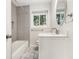 Beautiful bathroom with gray subway tile, a framed mirror, and modern fixtures at 46 Cooper Lake Sw Rd, Mableton, GA 30126