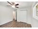 This bedroom boasts new flooring, fresh paint, a ceiling fan, and a closet at 46 Cooper Lake Sw Rd, Mableton, GA 30126