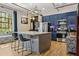 Bright kitchen featuring blue cabinetry, stainless steel appliances, and a large island with seating at 794 Ralph Mcgill Ne Blvd # 14, Atlanta, GA 30312