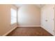 Carpeted bedroom with vaulted ceilings, a window, and a double door closet at 2436 Planters Mill Way, Conyers, GA 30012