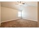 Simple bedroom with carpet, ceiling fan, and a large window that allows natural light in at 2436 Planters Mill Way, Conyers, GA 30012