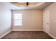 Bedroom with a ceiling fan, a window with blinds, and neutral colored walls at 2436 Planters Mill Way, Conyers, GA 30012