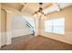 Inviting dining space with decorative ceilings, a modern chandelier, and large window at 2436 Planters Mill Way, Conyers, GA 30012