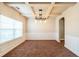 Formal dining area featuring a tray ceiling, modern lighting, and ample natural light at 2436 Planters Mill Way, Conyers, GA 30012