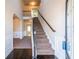 Bright foyer with staircase, hardwood floors, and open archways leading to other rooms at 2436 Planters Mill Way, Conyers, GA 30012