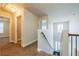 Upstairs hallway with natural light, neutral walls, and carpeted floor at 2436 Planters Mill Way, Conyers, GA 30012