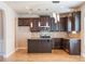 Modern kitchen with stainless steel appliances, dark cabinets, and tile backsplash at 2436 Planters Mill Way, Conyers, GA 30012