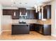 Modern kitchen featuring dark cabinets, stainless steel appliances, and tiled floor at 2436 Planters Mill Way, Conyers, GA 30012