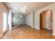 Spacious living room featuring a fireplace, modern lighting and neutral paint palette at 2436 Planters Mill Way, Conyers, GA 30012