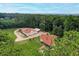 Aerial view of the property with lush greenery, outbuildings, and a long driveway at 2585 Braselton Hwy, Buford, GA 30519