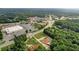 Aerial shot highlighting the property's proximity to shopping and wooded surroundings at 2585 Braselton Hwy, Buford, GA 30519