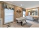 Elegant bathroom showcasing a clawfoot tub, vanity with countertop space, and sophisticated decor at 2585 Braselton Hwy, Buford, GA 30519