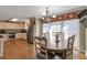 Dining area next to kitchen, featuring hardwood floors, natural light, and convenient access to an outdoor deck at 2585 Braselton Hwy, Buford, GA 30519