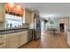 Well-lit kitchen featuring granite countertops, stainless steel appliances, and an adjacent dining area at 2585 Braselton Hwy, Buford, GA 30519