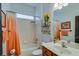 Bright bathroom features a shower/tub combo and modern fixtures at 832 Chalet Hls, Mcdonough, GA 30253