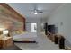 Bright main bedroom with wood accent wall and sliding barn door to bathroom at 832 Chalet Hls, Mcdonough, GA 30253