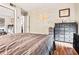 Spacious bedroom with wood floors and a large dresser at 104 River Run Dr, Atlanta, GA 30350