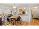 Open dining area with wood floors, seamlessly flowing into the kitchen and living spaces at 104 River Run Dr, Atlanta, GA 30350