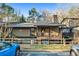 Exterior shot of a cozy home with a balcony and serene setting at 104 River Run Dr, Atlanta, GA 30350