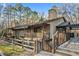 View of exterior featuring wood siding, balcony, and natural surroundings at 104 River Run Dr, Atlanta, GA 30350