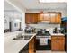Traditional kitchen features wood cabinets, stainless appliances, and a functional layout at 104 River Run Dr, Atlanta, GA 30350