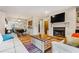 Inviting living room featuring a fireplace and open dining area at 104 River Run Dr, Atlanta, GA 30350