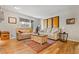 Bright living room features wood floors, neutral furniture, and sliding doors at 104 River Run Dr, Atlanta, GA 30350