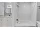 Bathroom featuring subway tile surround bathtub, vanity, and bronze fixtures at 117 Lablanc Nw Way, Atlanta, GA 30327