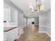 Bright dining room with chandelier and tiled floors at 117 Lablanc Nw Way, Atlanta, GA 30327